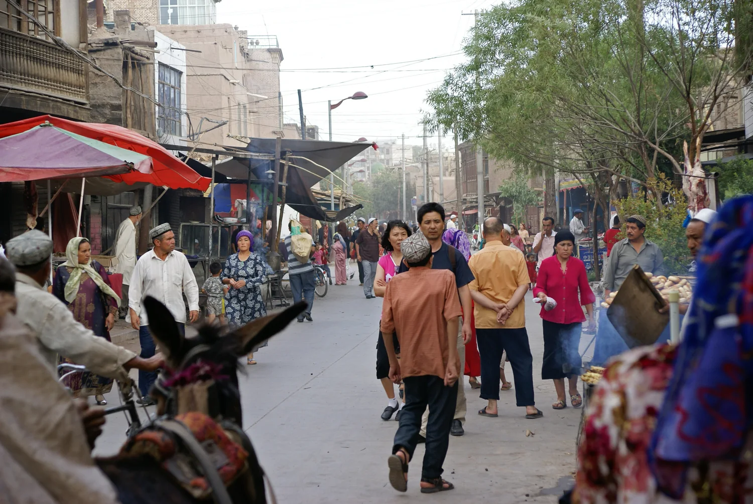 Street trade in Kashgar. Modern urban life continues beyond the Old City and within it.