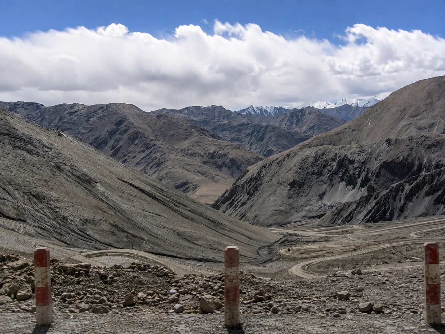 High-resolution visual of a high-altitude plateau and distant snow mountains