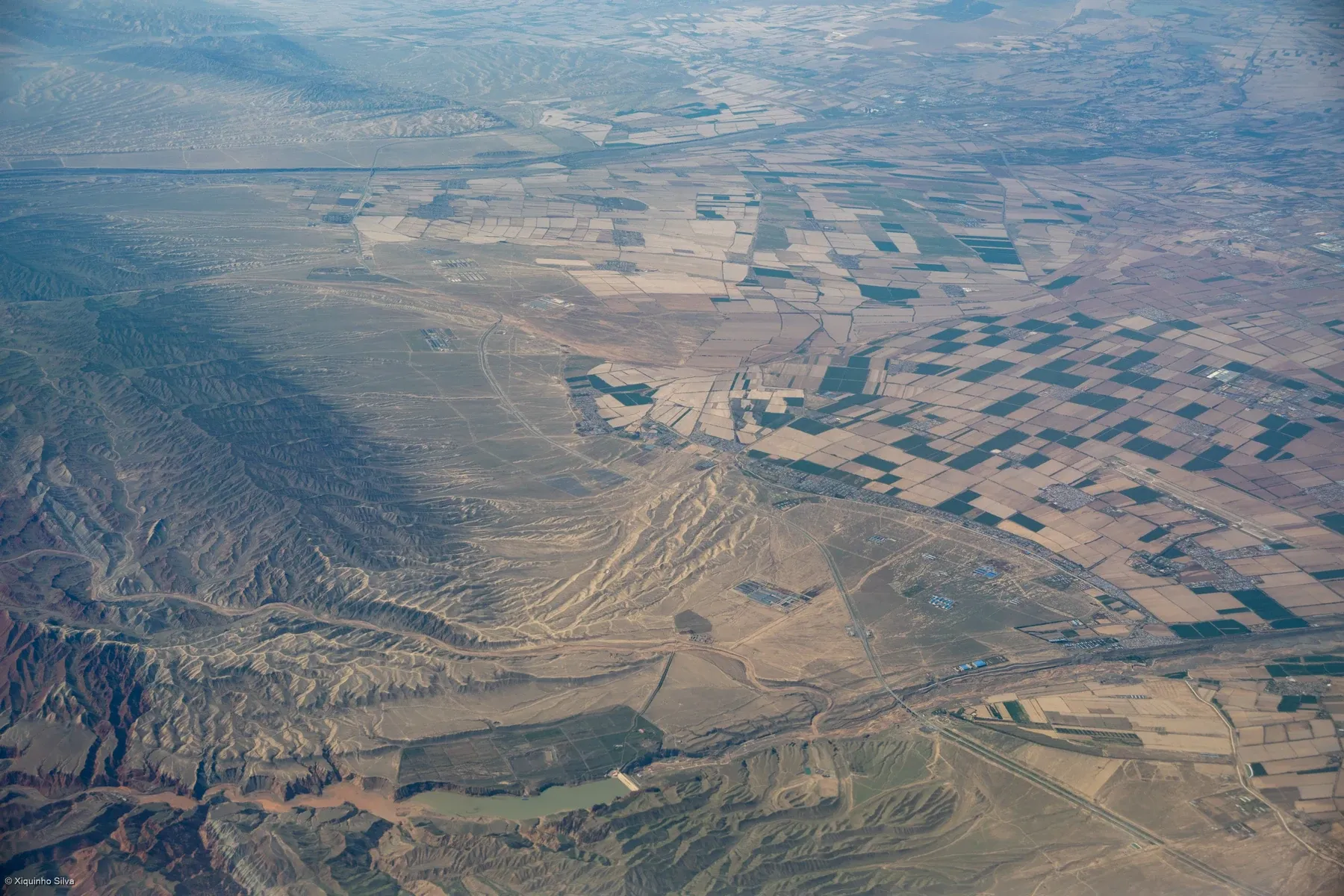 A 2025 photograph of piedmont land and farmland on the northern slope of the Tianshan