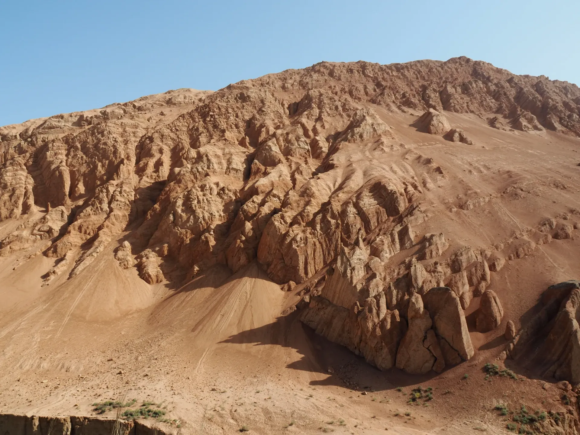 Exposed red mountain slopes and gullies at the Flaming Mountains, Turpan, Xinjiang